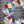 Load image into Gallery viewer, A round funeral wreath with red, white and blue flowers for a Veteran or Military Person.