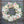 Load image into Gallery viewer, A round funeral wreath with white and pale pink flowers