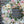 Load image into Gallery viewer, A round funeral wreath with white and pale pink flowers.