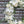 Load image into Gallery viewer, A round funeral wreath with white flowers.
